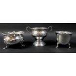 A group of three silver bon bon dishes, comprising a twin handled dish, raised on a circular foot