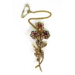 A 9ct gold, pearl and ruby flower brooch, with safety chain, 5.3cm, 5.5g.