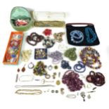 A large collection of costume jewellery, including several silver, gold and amber items. (1 bag)