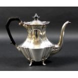 An Edward VII silver coffee pot, of fluted, baluster form, with ebonised finial and handle, raised