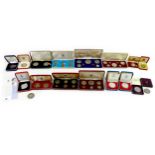 A collection of 20th century commemorative coins, most in original cases, including two Churchill