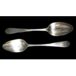 A pair of George III Scottish silver table spoons, with rubbed initials to finials, possibly '