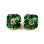 A pair of gold, diamond and emerald earrings of quatrefoil flowerhead design, 6.4 by 6.4mm, 1.9g.