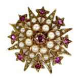 A 9ct gold, ruby and pearl starburst brooch, 3.1cm diameter, 5.4g.