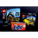 Two sets of Technic Lego, comprising a Volvo EW160E 42053 set and a 42028 set, together with a Power