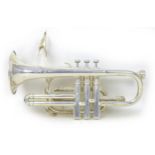 A silver plated Corton cornet with fitted hard case.