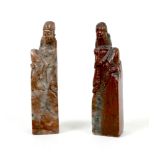 A pair of Chinese soapstone carvings, early 20th century, a modelled as a mirrored pair