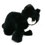 A vintage Steiff black plush cat, circa 1970, 36 by 22cm high.