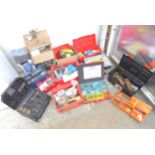 A collection of tools and tool boxes, screws, drill sharpener, four saws, water pump, a propeller