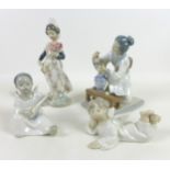 A group of four Lladro figurines, comprising 'Angel Laying Down', 01004541, 7.5cm high, 'Angel',
