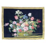 A Belgian Metrax tapestry, circa 1980, depicting a basket of flowers, against a black ground, 100 by
