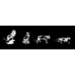 Four Swarovski crystal ornaments, comprising a lion A7610 NR 000 004, 12cm high, a lioness A7610