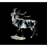 A Swarovski crystal ornament of a stag with silvered antlers, A7608 000 004, 14cm high, with