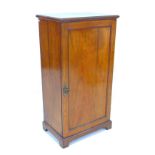 A Victorian mahogany silver cupboard, with three shelves enclosed by a single door, 57.5 by 39 by