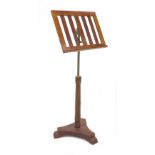 An early Victorian mahogany library reading stand, with tilt and height adjusting surface, brass