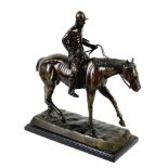 A modern cast bronzed metal sculpture, modelled as a horse and rider
