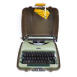 A 20th century Imperial 'Good Companion 5' portable typewriter, in pale green, with two keys,
