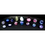 Fifteen glass paperweights, comprising nine Caithness paperweights, 'Moonflower', 7cm high, '