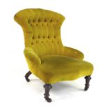 A Victorian nursing chair, upholstered in button back yellow Dralon, raised on turned legs and
