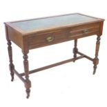 An Edwardian mahogany writing desk, with green leather inlaid top above two drawers with brass