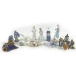 A collection of Lladro figurines, including 'Girl with Duck', SKU 01001052, 25cm high, a sitting nun