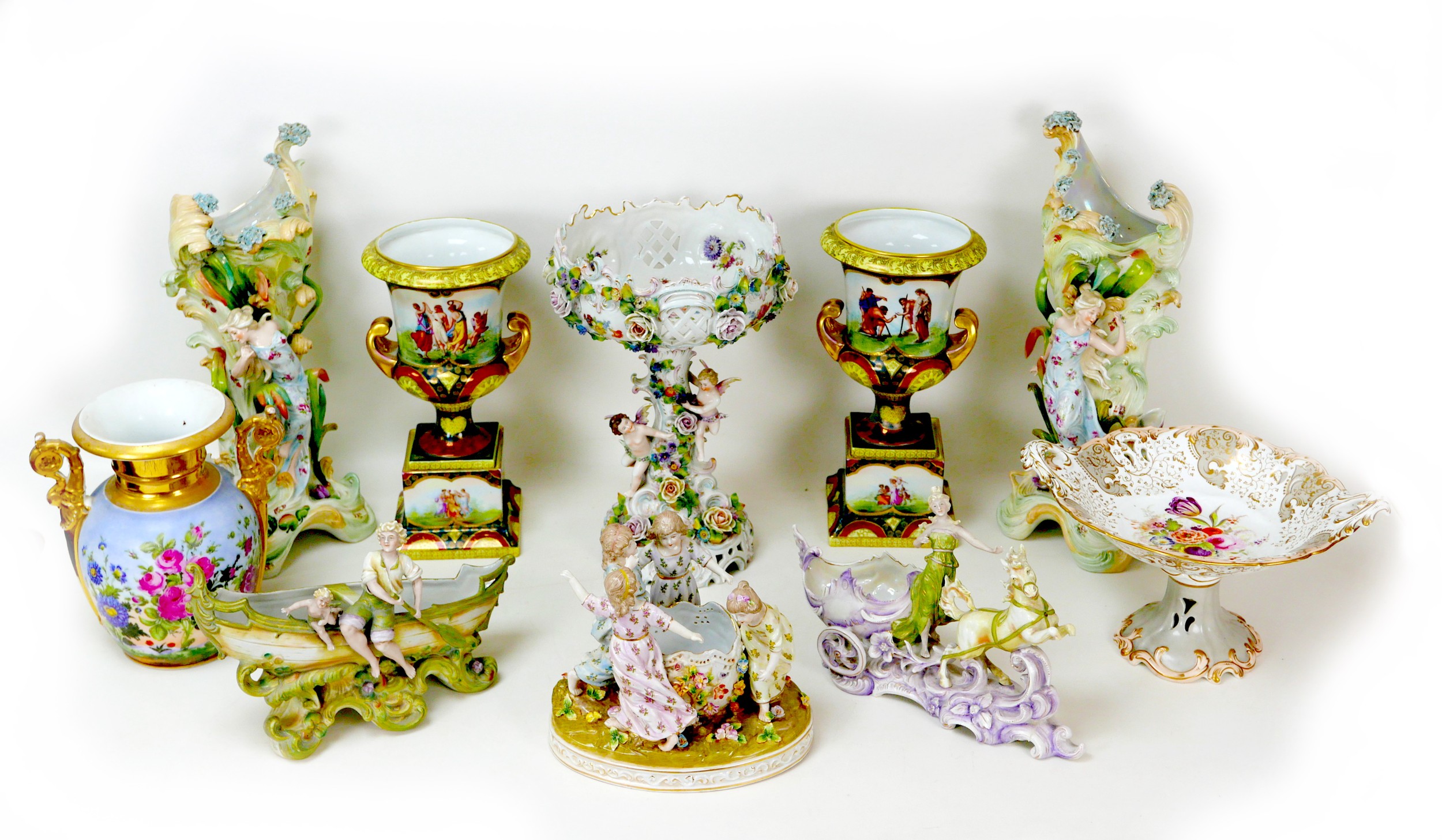 Ten 19th century style porcelain centrepieces and spill vases, including a Dresden style centrepiece