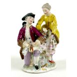 A Continental 19th century porcelain figure group, in the style of Dresden, modelled as a