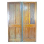 A pair of four panelled stained pine doors, 71 by 4 by202cm high.