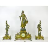 A 19th century continental spelter and onyx garniture clock, the clock surmounted by a large