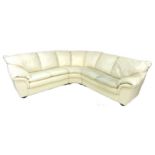 A group of three modern white leather sofas, comprising a corner five seater, a three seater, and