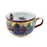 A 19th century porcelain small chamber pot, a/f missing cover and several cracks, decorated in