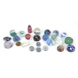 A collection of twenty-five 20th century glass paperweights, comprising a William Manson "1998