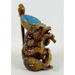 A late 19th century German pottery novelty pitcher jug, modelled as a seated bear, mouth open from