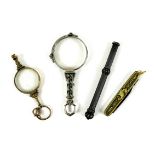 A group of objects of vertu, comprising a pair of early 19th century gold plated lorgnettes, with