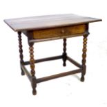 A 17th century oak side table, the rectangular three plank surface with breadboard ends, above a