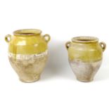 Two late 19th/early 20th century French glazed stoneware confit pots, both with lug handles