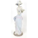 A Lladro porcelain figure, 'Tea Time', 5470, 36.5cm high, in original box.