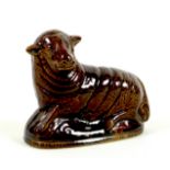 A rare Newcastle pottery figure, 17th / 18th century, modelled as a recumbent sheep, all over