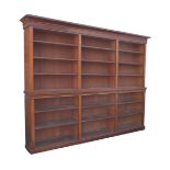 A very large Edwardian mahogany bookcase, made up of six sections, each with four shelves, 280 by 38