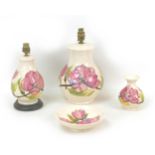 Four pieces of Moorcroft Pottery Magnolia pattern wares, including two table lamps, largest, 18 by