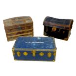 A group of three 19th century travelling trunks, comprising a barrel top wooden bound trunk,
