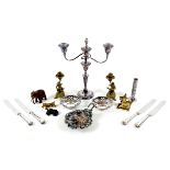 A group of mixed metal collectables, comprising a pair of cast brass figural candlesticks, each