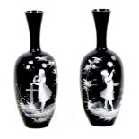 Two Mary Gregory style vases, each with applied decoration of a young girl playing outside, on black