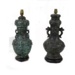 Two 20th century Oriental style bronzed metal table lamps, both of baluster form raised upon