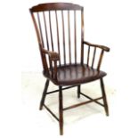 An American 19th century 'Windsor' style open armchair, the high back with a stepped top rail