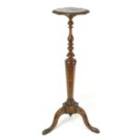 A 19th century Dutch marquetry jardiniere stand, with a quatrefoil form top, turned column, tripod