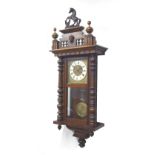 A 20th century mahogany and stained pine Vienna wall clock, with resin rearing horse surmount, Roman