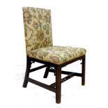 A Georgian mahogany side chair, squared back and seat, padded and upholstered in floral