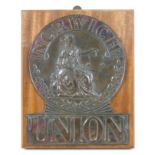 A Victorian pressed metal insurance plaque, 'Norwich Union' Fire Insurance Society Fire Mark, the