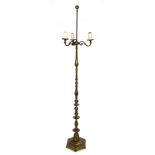 An early to mid 20th century brass standard lamp, with three S shaped branches, the knopped column